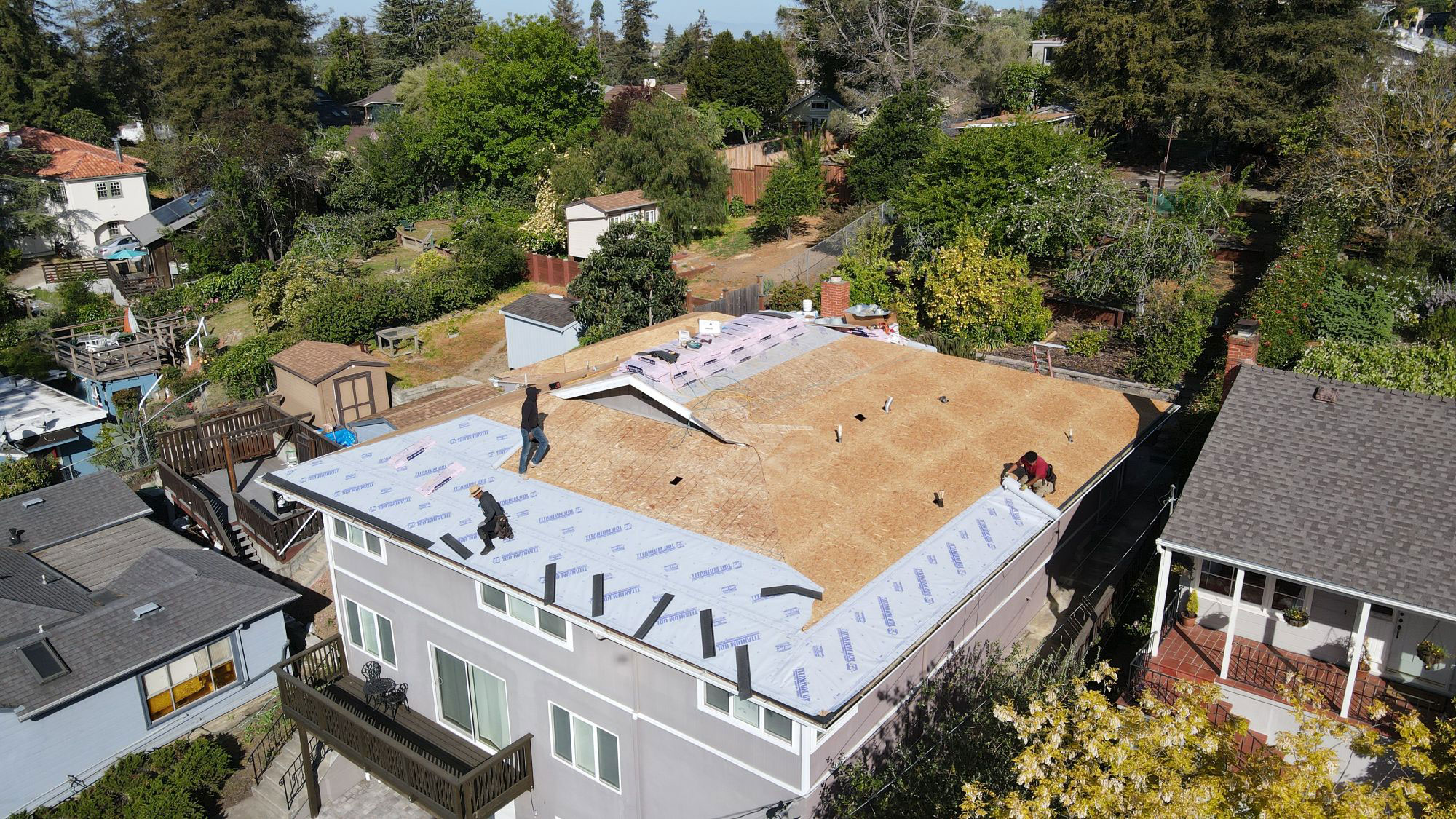 A house under construction with a visible roofing project in progress.